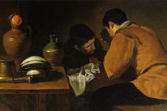 two-young-men-eating-at-a-humble-table