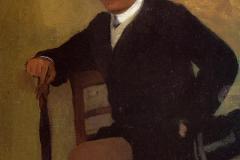 seated-young-man-in-a-jacket-with-an-umbrella