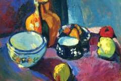 dishes-and-fruit-on-a-red-and-black-carpet-1901