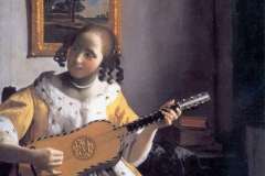 youg-woman-playing-a-guitar