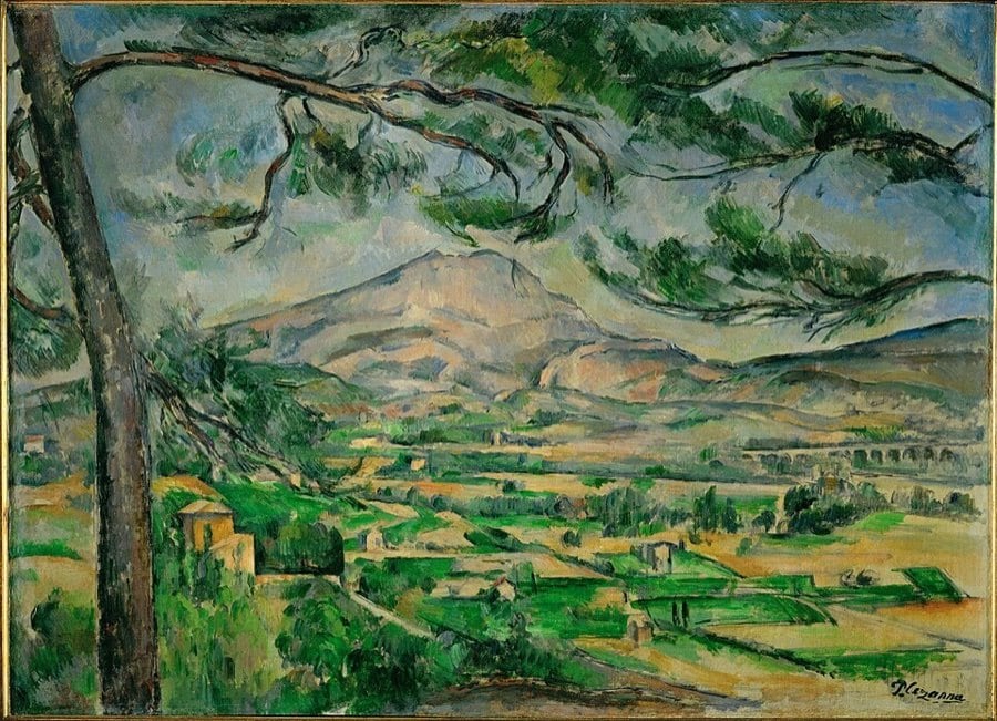 Önde dalları sarkan bir çam, arkada yeşil vadi ve uzakta Sainte-Victoire Dağı