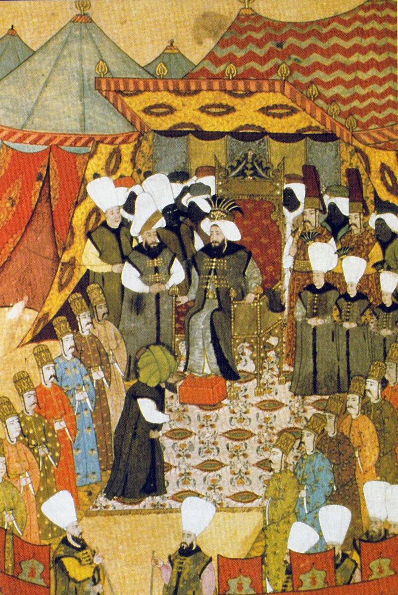 Levni'nin Surname-i Vehbi minyatürü: 1720 şenliklerinde çadırın önünde tahtında oturan III. Ahmed ve çevresindeki saray görevlileri