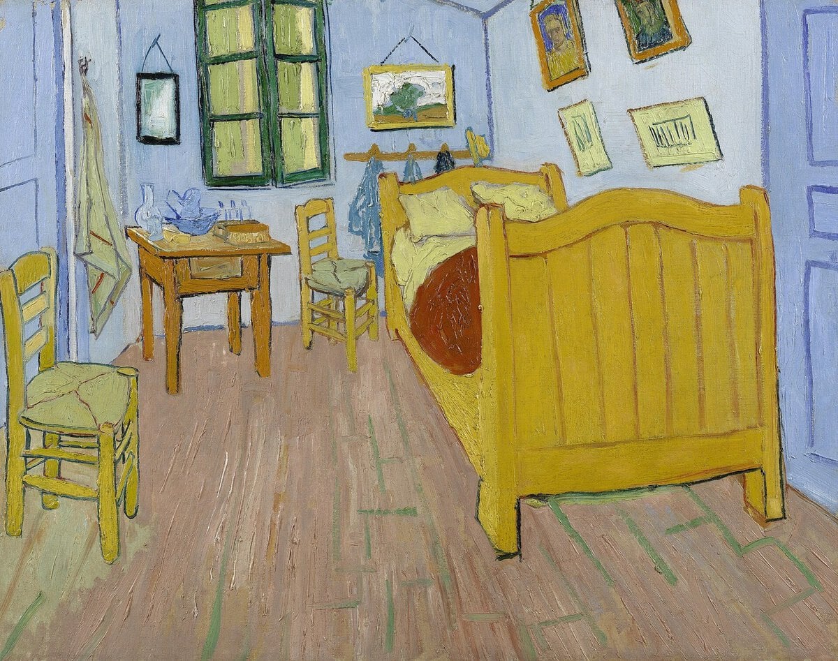 Van Gogh'un Arles'daki Yatak Odası tablosu: sarı ahşap yatak, iki hasır sandalye, küçük masa ve mavi duvarlar