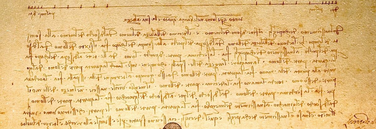 Vitruvius Adamı çiziminin altındaki ölçek çizgisi ve Leonardo'nun ayna yazısıyla tuttuğu notlar